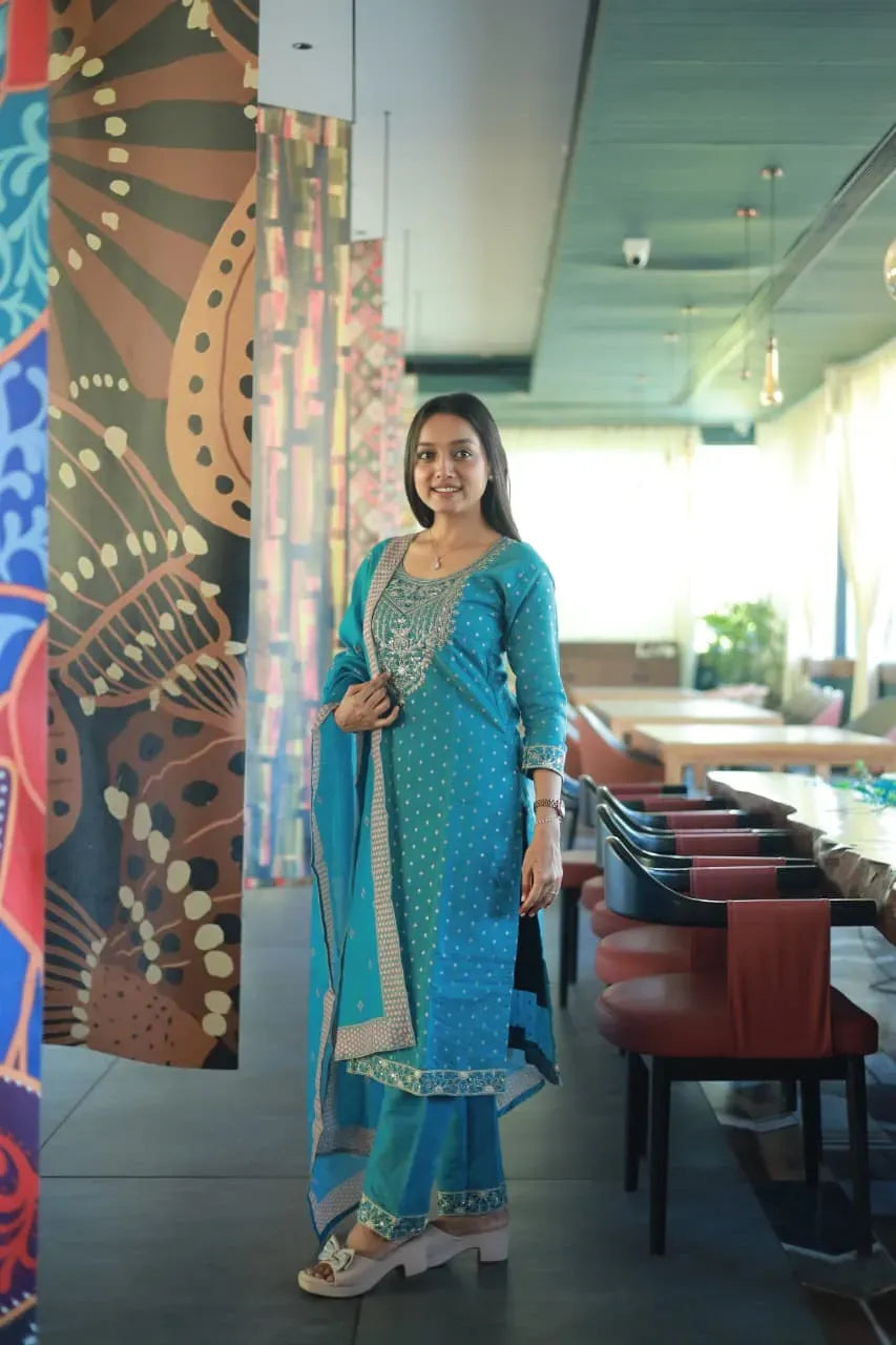 Model wearing sky blue chanderi cotton kurti set with digital printed dupatta in restaurant