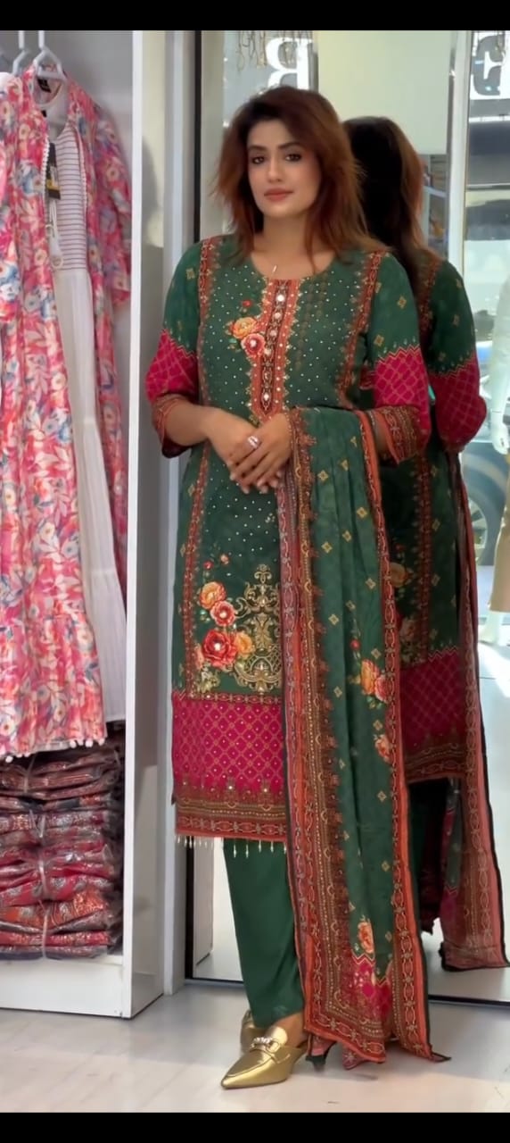 TRENDBUY Green Chinon Floral Print Suit Set for Women with mirror work and embroidery, modelled in a store setting.