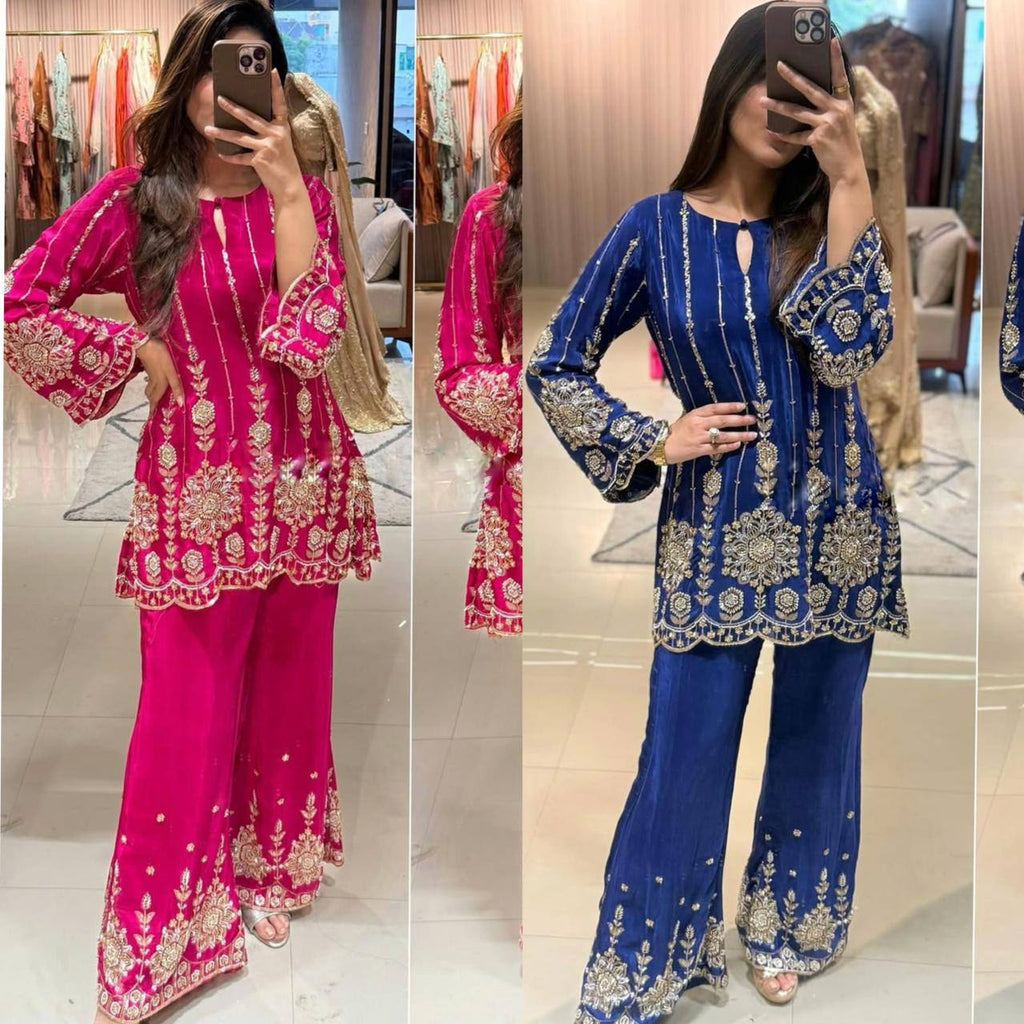 Women's Chinon Silk Top Palazzo Set in Hot Pink and Royal Blue, modeled in a store