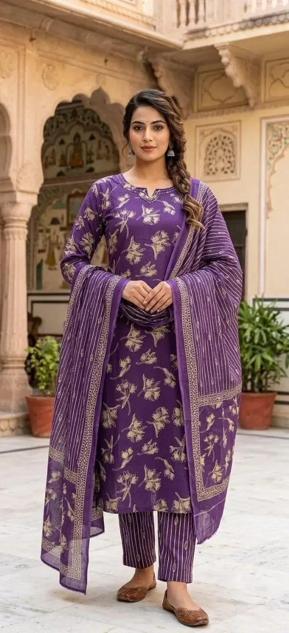 Model wearing purple Jaipuri cotton kurti set with dupatta in heritage courtyard