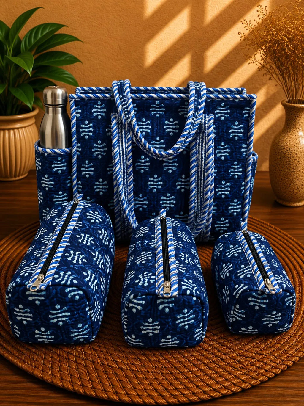 Blue tie-dye print cotton quilted tote bag with matching utility pouches