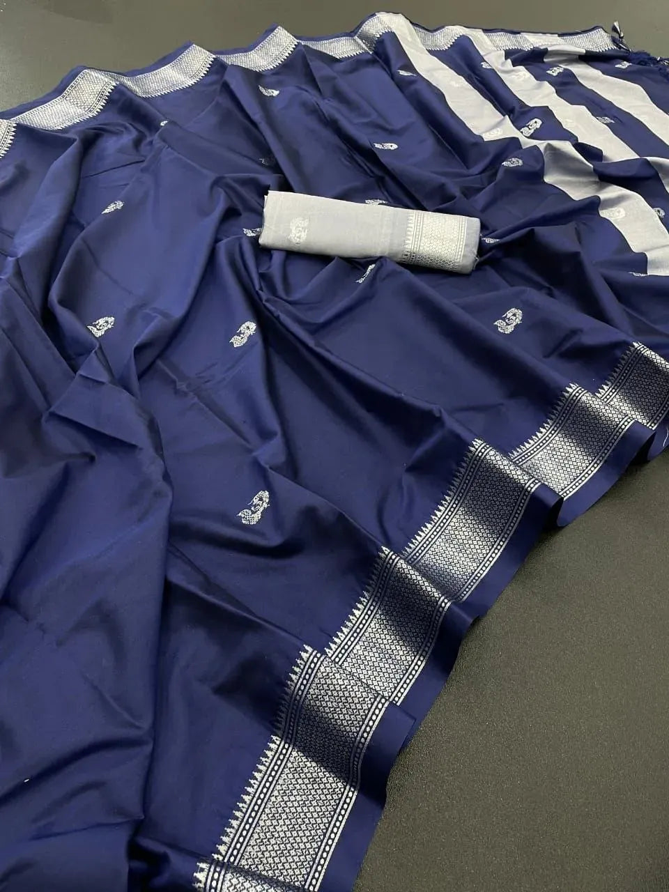 Navy blue cotton silk paithani saree with silver zari border and folded blouse piece