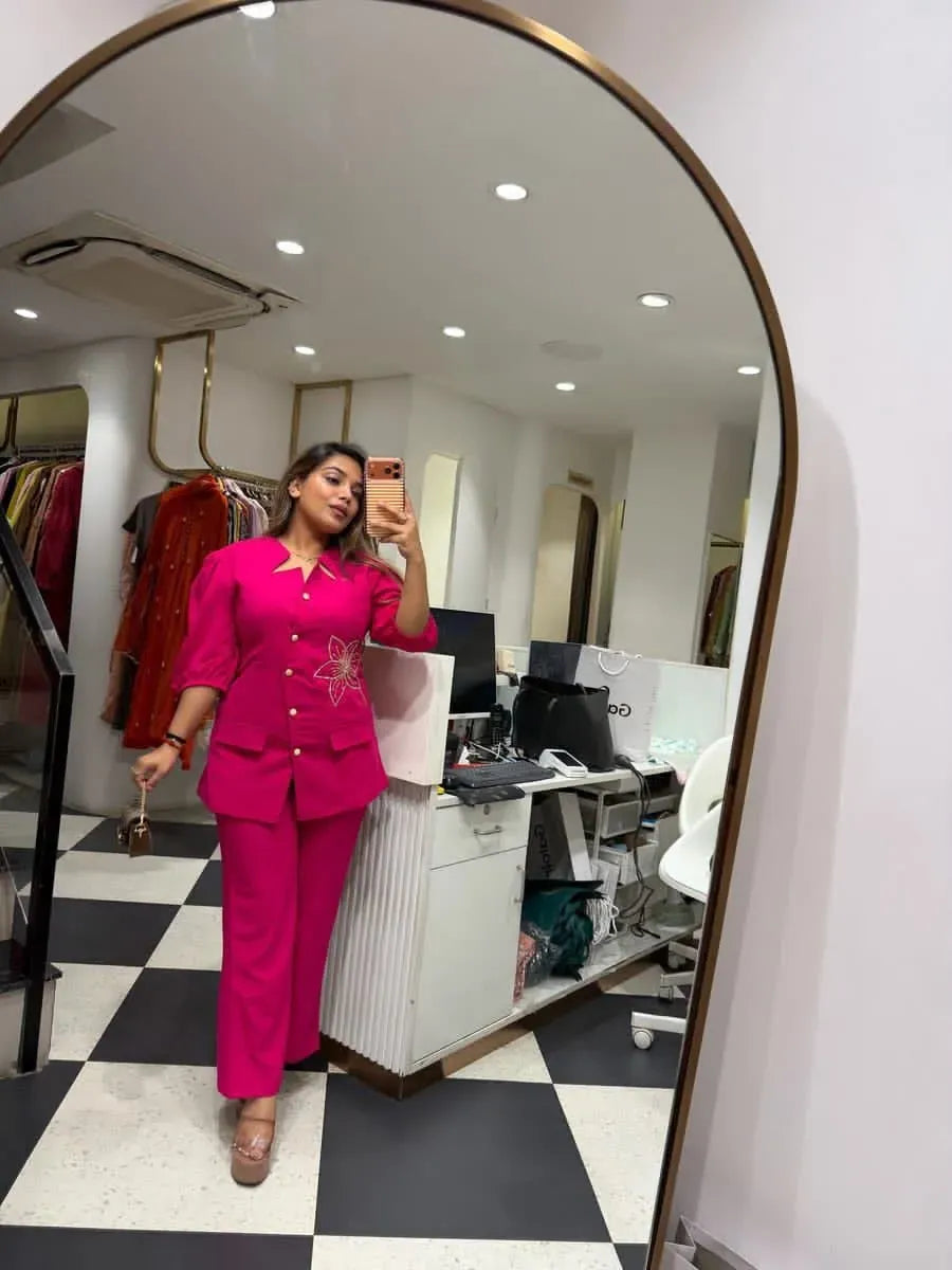 Woman wearing hot pink cotton slub cord set in mirror selfie