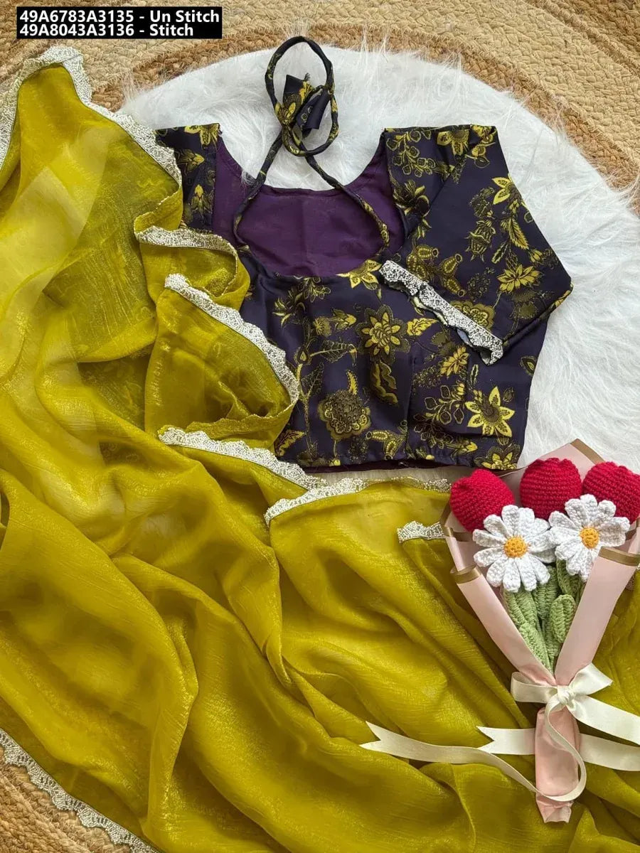 Mustard Yellow Crunchy Chiffon Saree with Dark Purple Floral Kalamkari Print Blouse and Seroski Lace Border, flat lay on a white fur rug with a decorative bouquet