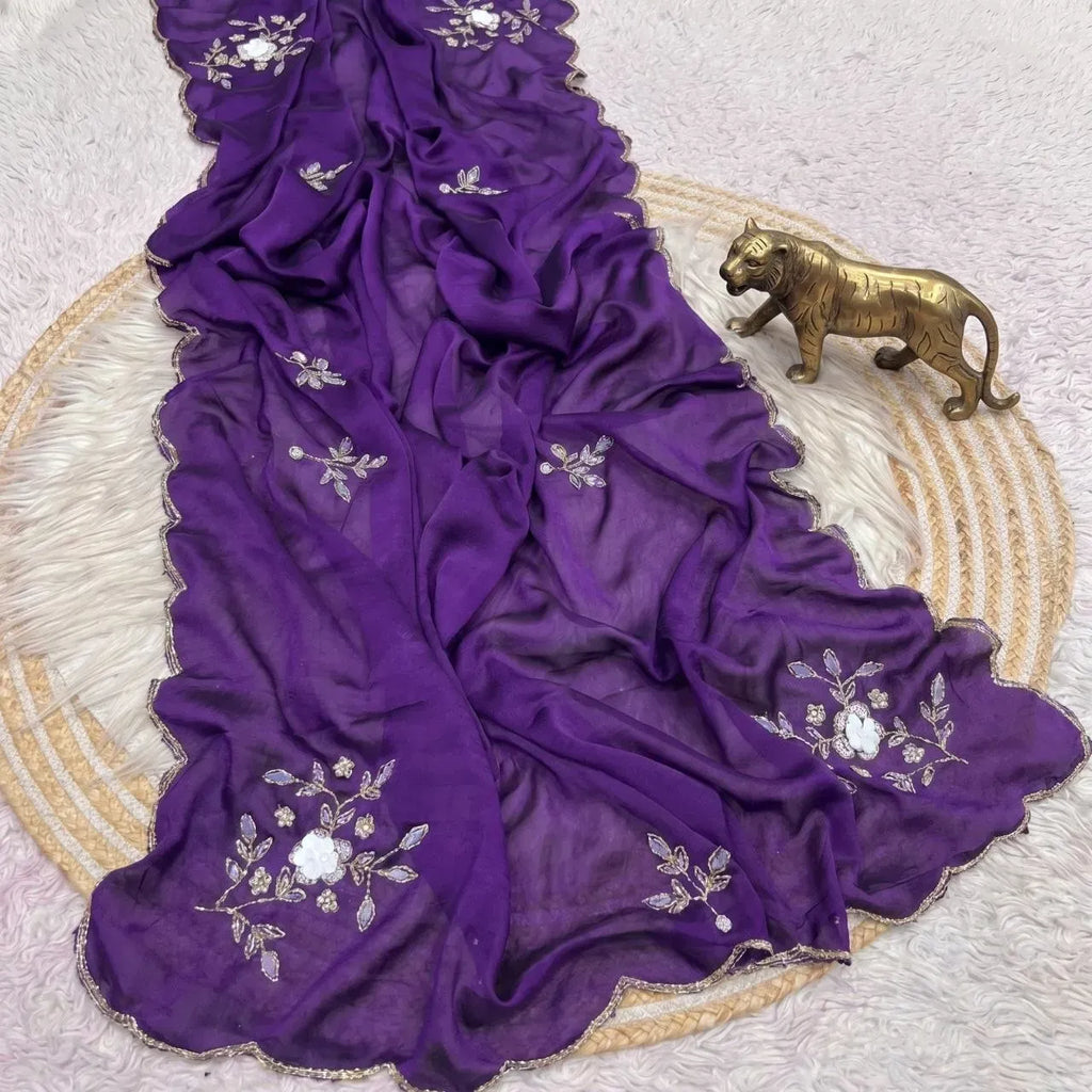 Purple crush silk saree laid out flat with detailed white floral embroidery