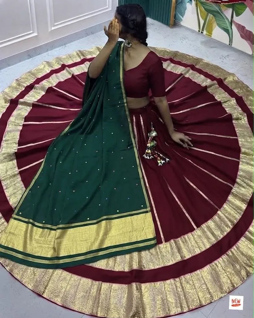 Model wearing maroon roman cotton silk skirt with green dupatta and lampi border