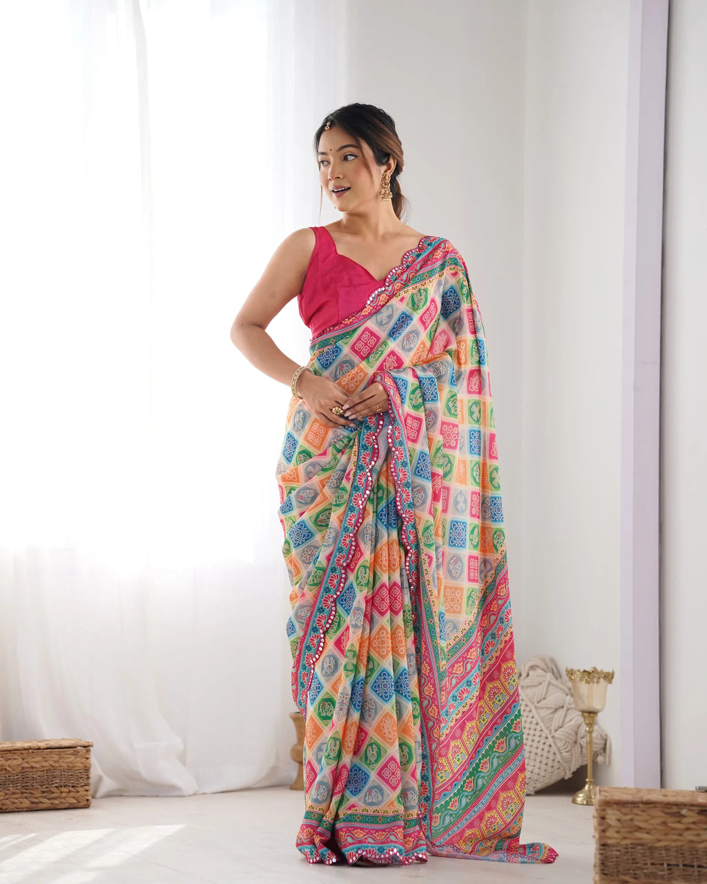 Model wearing multicolor printed heavy chinnon saree with pink blouse