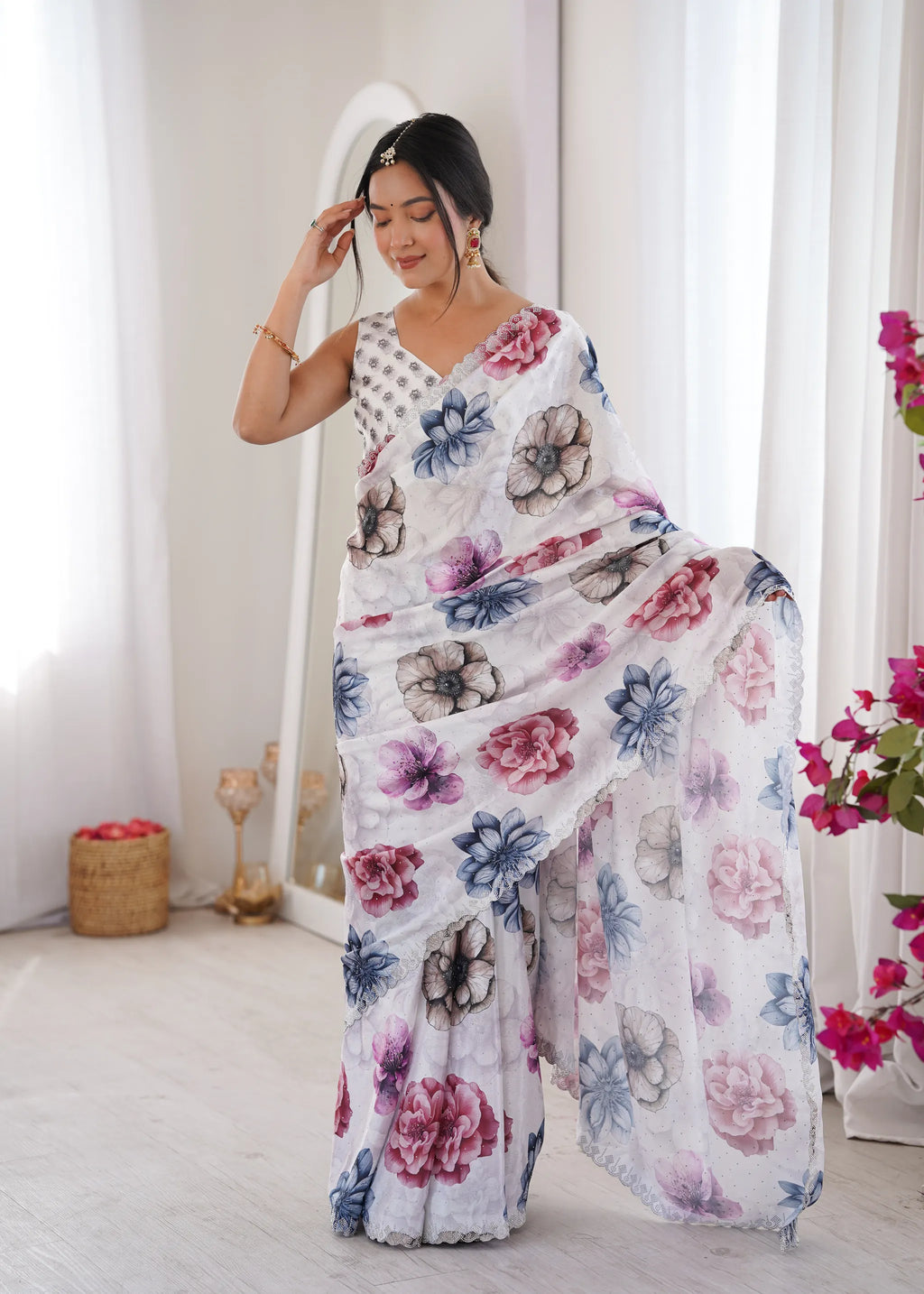 Model posing front-facing in white digital printed chinnon saree with floral motifs