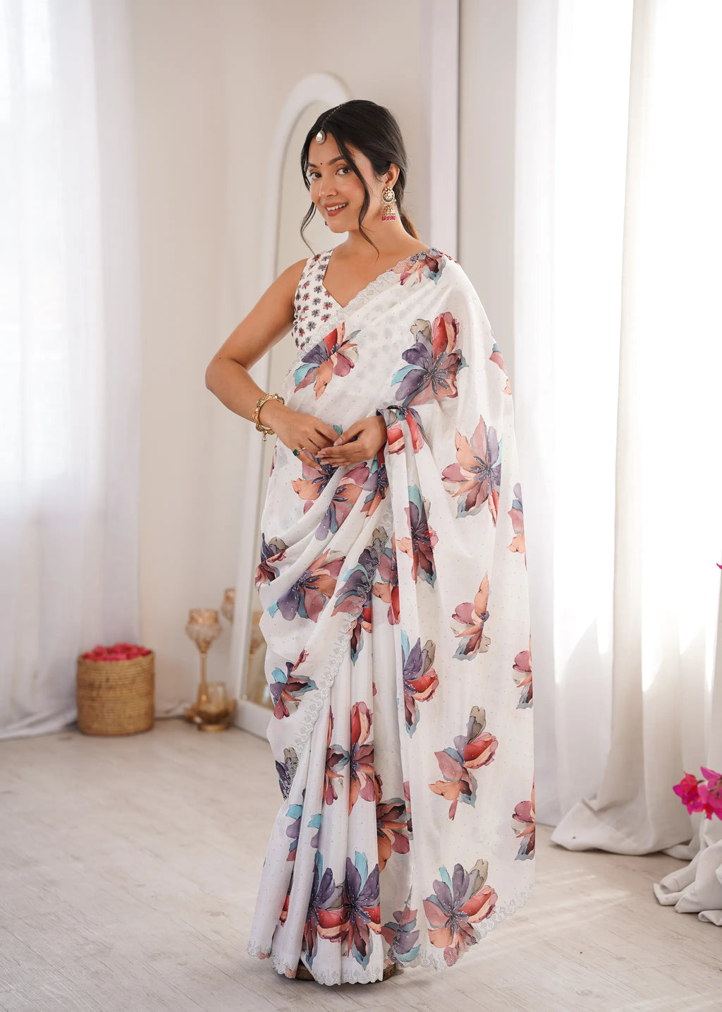 Model wearing white heavy chinnon saree with floral digital print and sworski work
