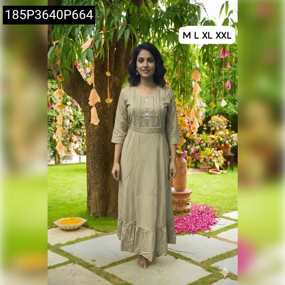 Model wearing elegant women's heavy rayon maxi dress in a light beige/khaki color, standing in a garden setting, perfect for everyday elegance.