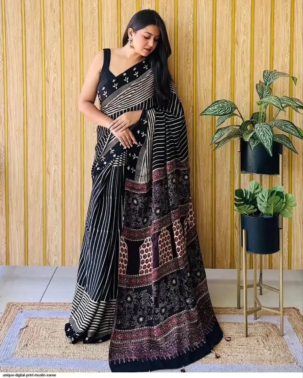 Model wearing black digital print Japan satin saree with floral motifs