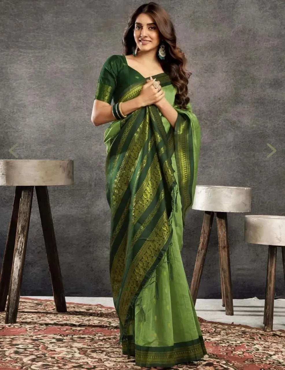 Model wearing light green Kalyani cotton saree with dark green border front view