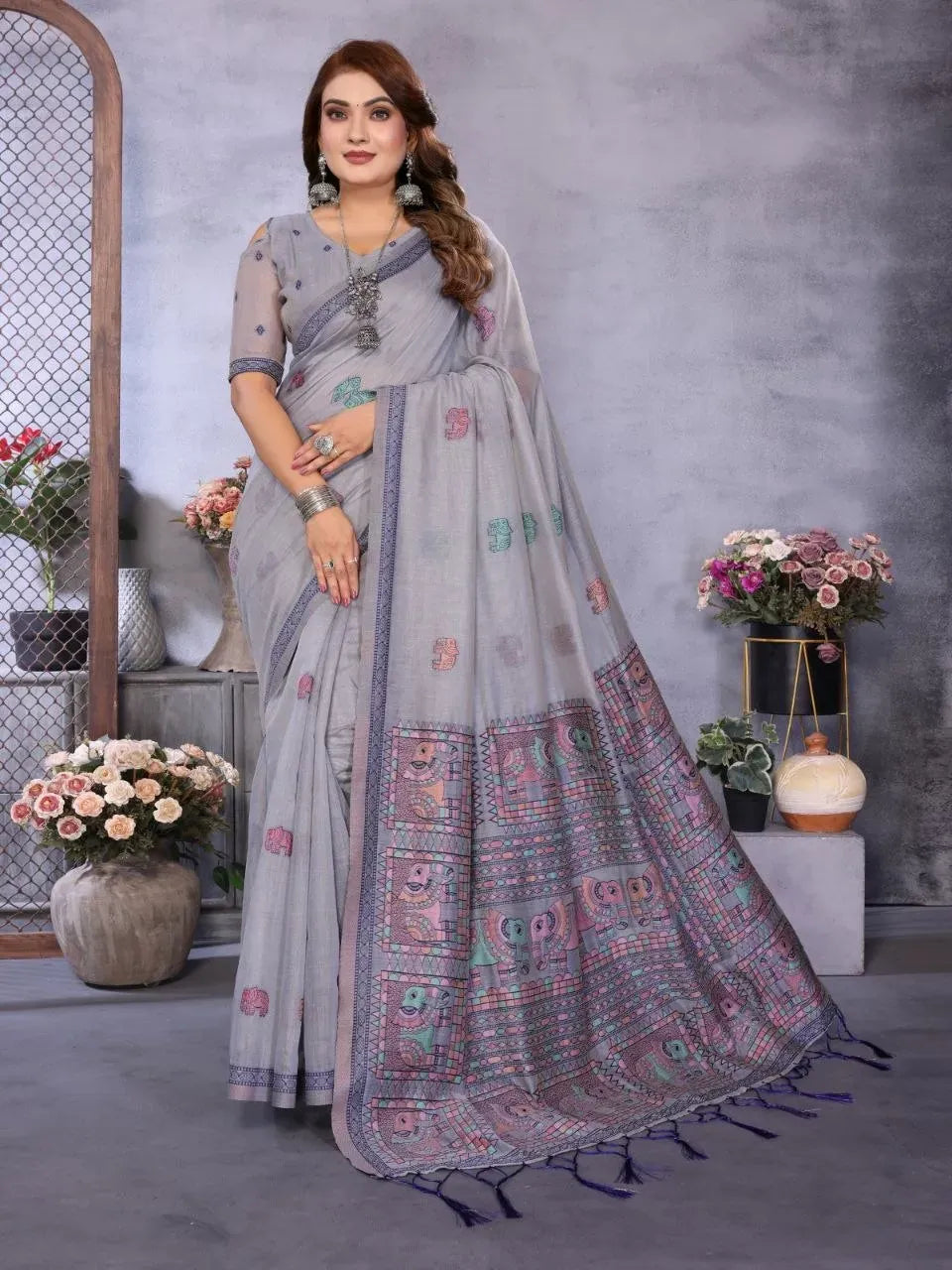 Model wearing grey spun khadi cotton jacquard saree with traditional motifs