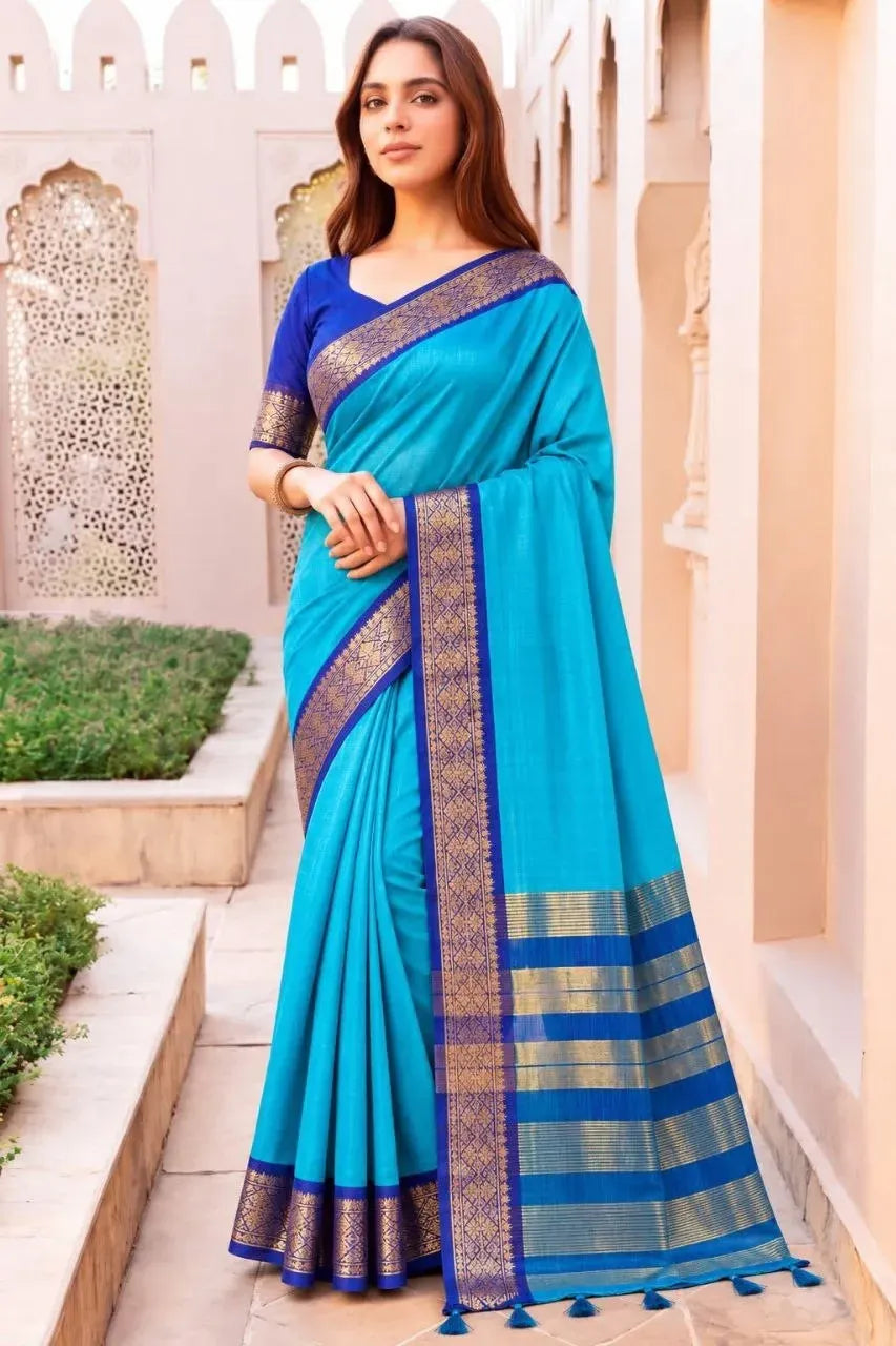 Model wearing sky blue kota doriya silk saree with royal blue blouse