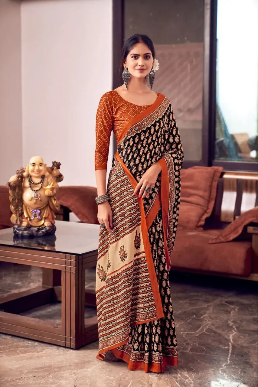 Model wearing black and rust printed mal mal cotton saree