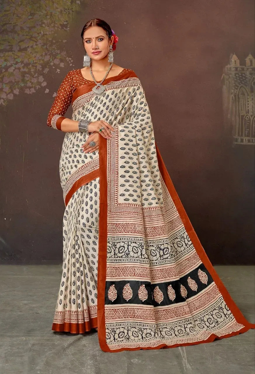 Model wearing cream and brown printed mal mal cotton saree