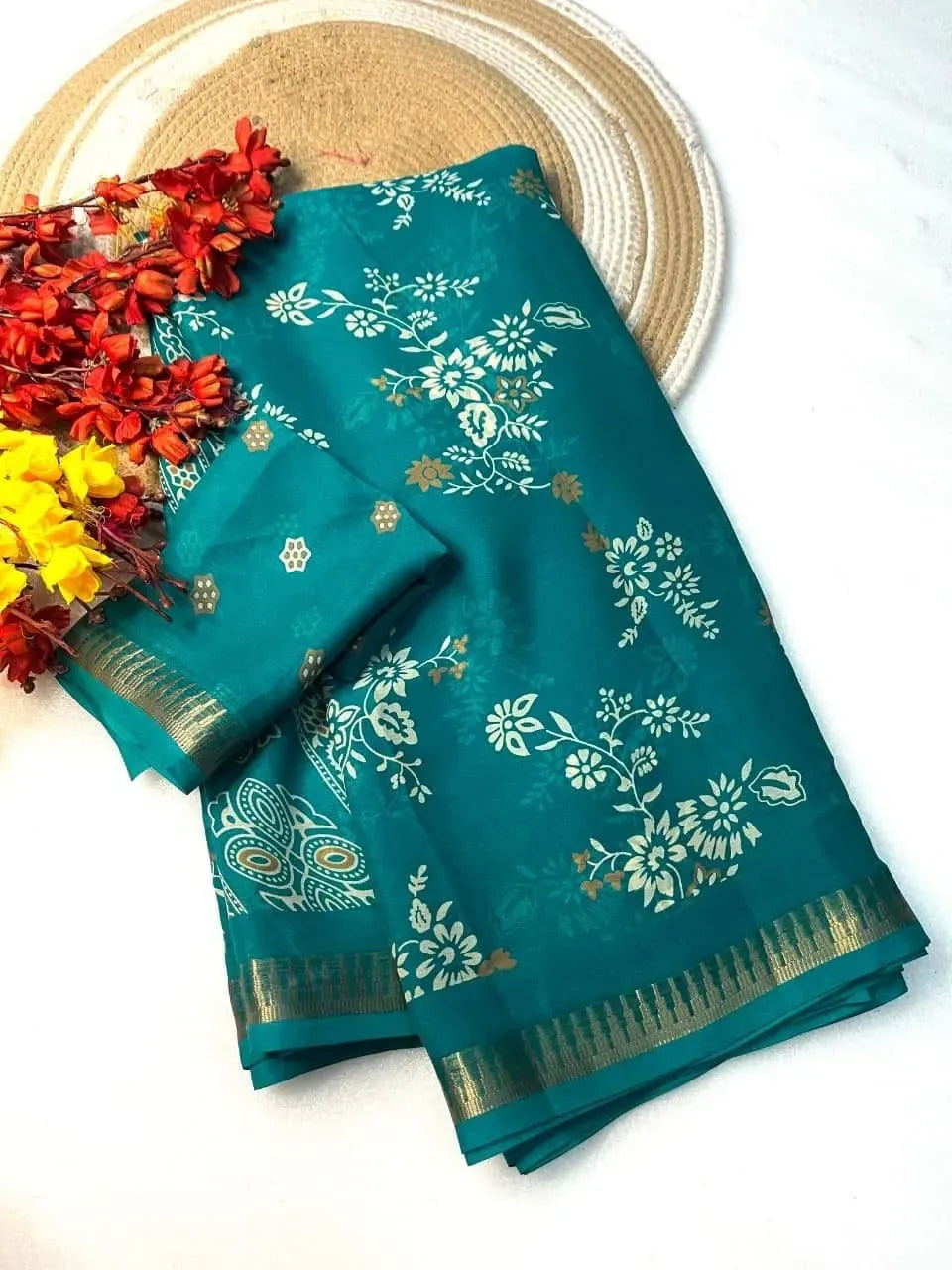 Teal blue marshmallow fabric saree with floral print and gold border