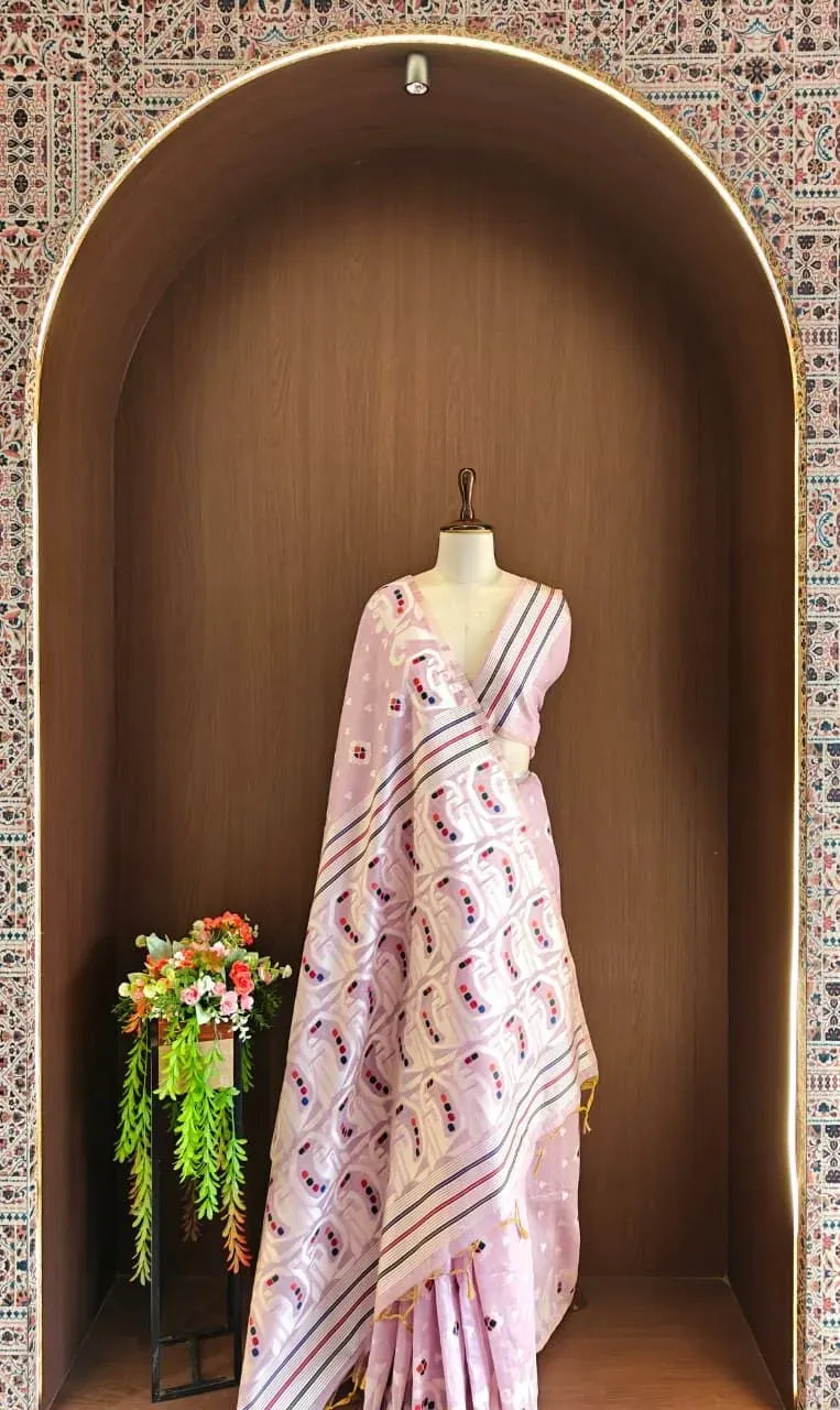 Lavender muga cotton saree displayed on a mannequin inside an arched alcove