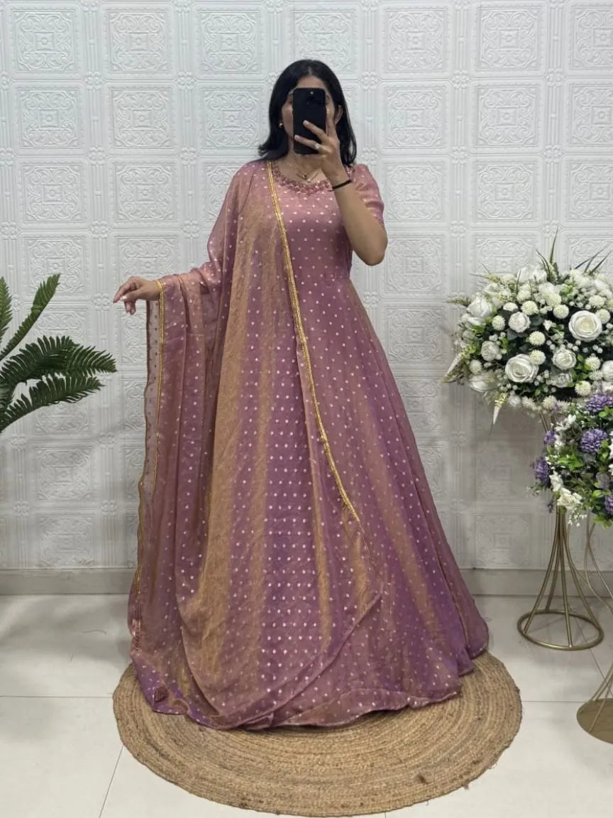 Model showcasing front view of mauve purple NC moss butti gown with gold handwork neckline and sheer dupatta