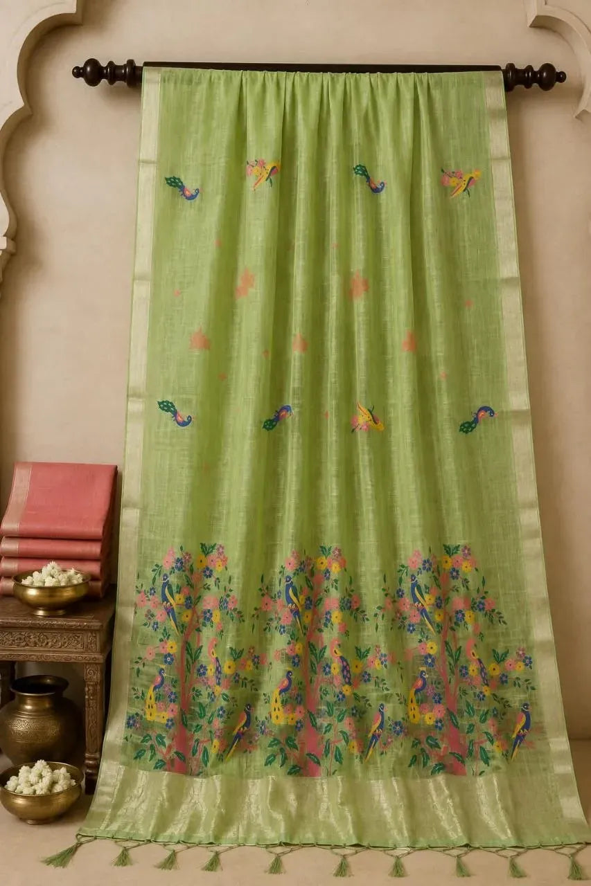 Light green Peshwai cotton saree hanging with floral and peacock motifs