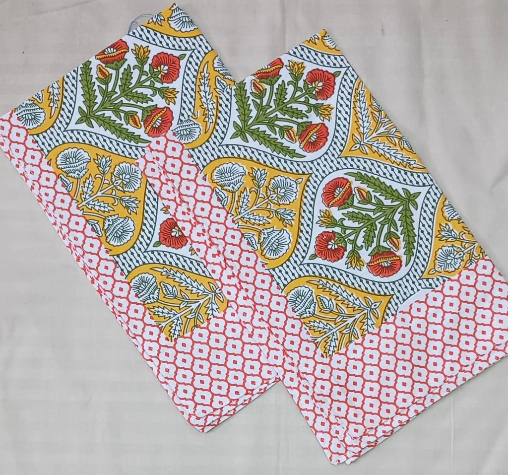 Yellow and red floral print pure cotton pillow covers folded neatly