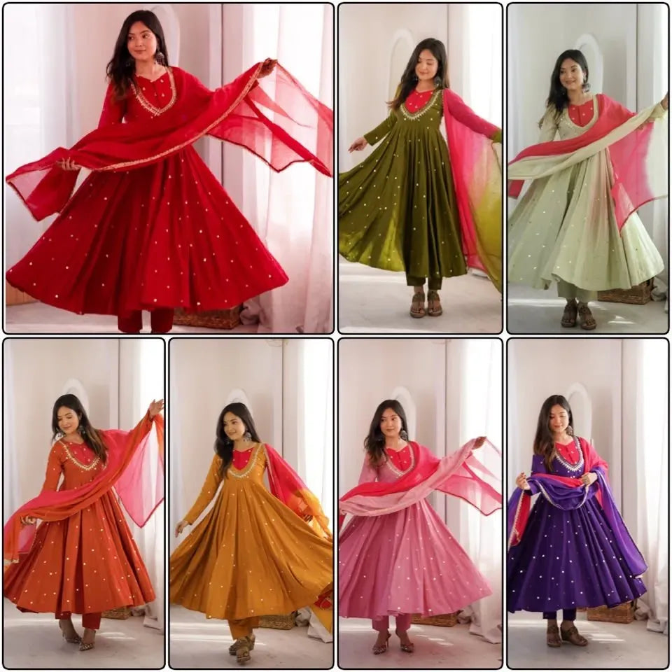 Model wearing bright red roman silk gown with mirror work and dupatta