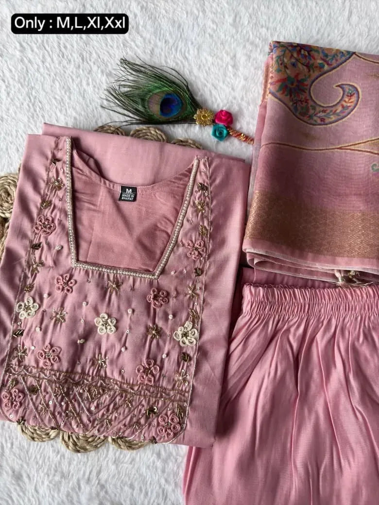 Model in a cream Roman silk kurta set with a contrasting pink Chanderi bandhani dupatta