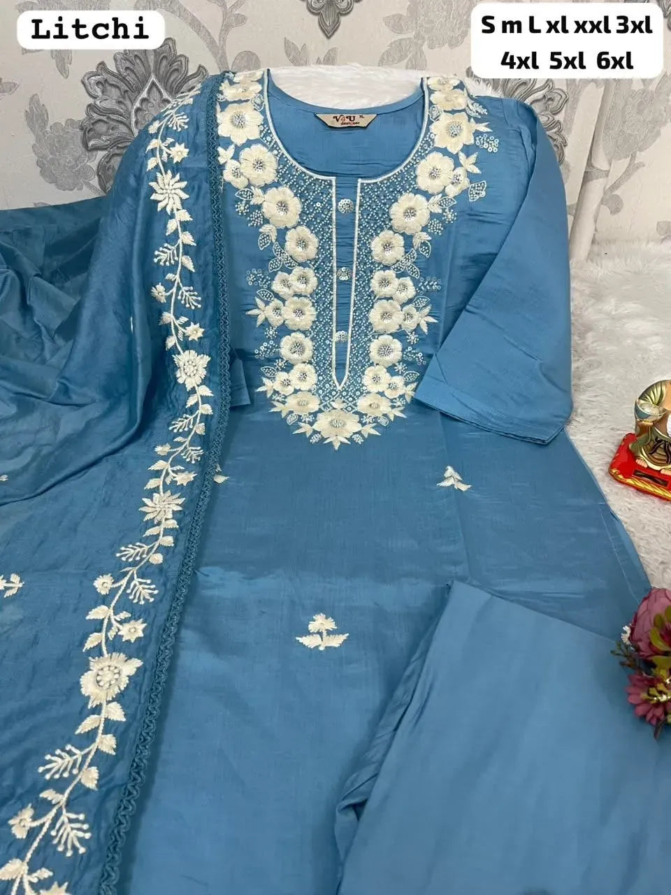 Blue Roman silk kurti pant set with embroidered dupatta on white surface
