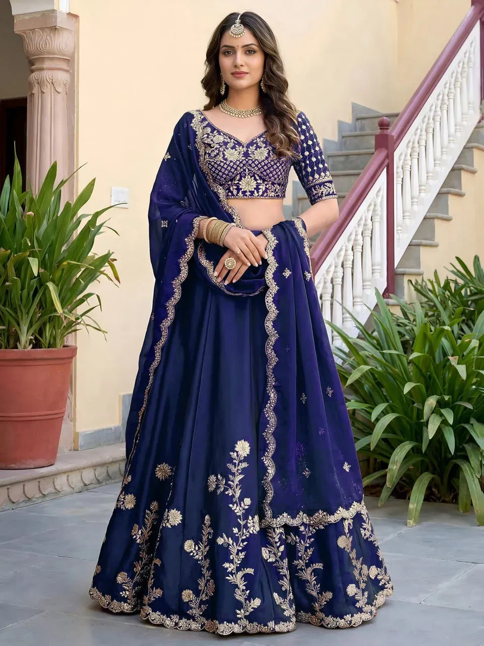 Full body front view of model wearing royal blue embroidered lehenga choli