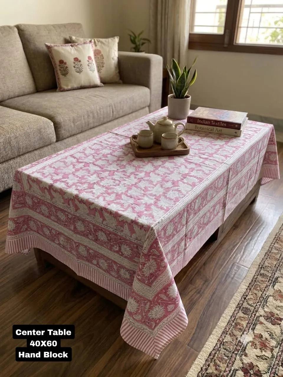 Pink Sanganeri hand block printed cotton center table cover on wooden table
