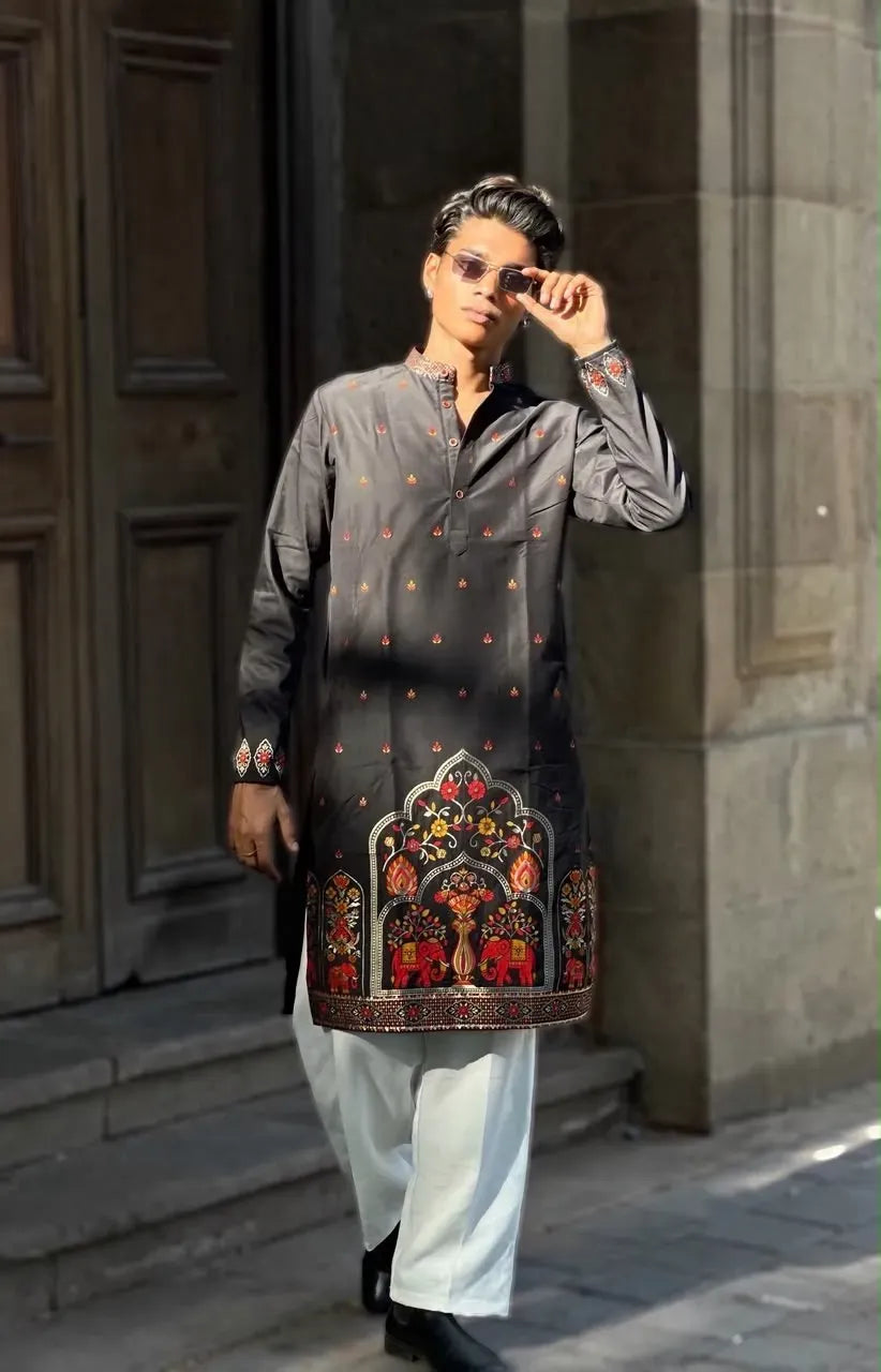 Full body front-facing view of male model wearing black silk kurta and white pyjama outdoors
