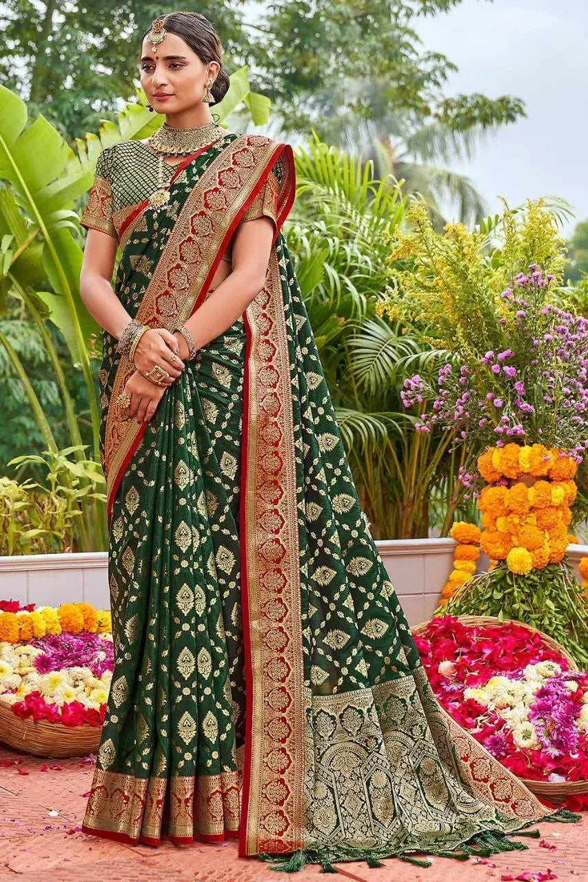 Model wearing dark green traditional zari woven silk saree