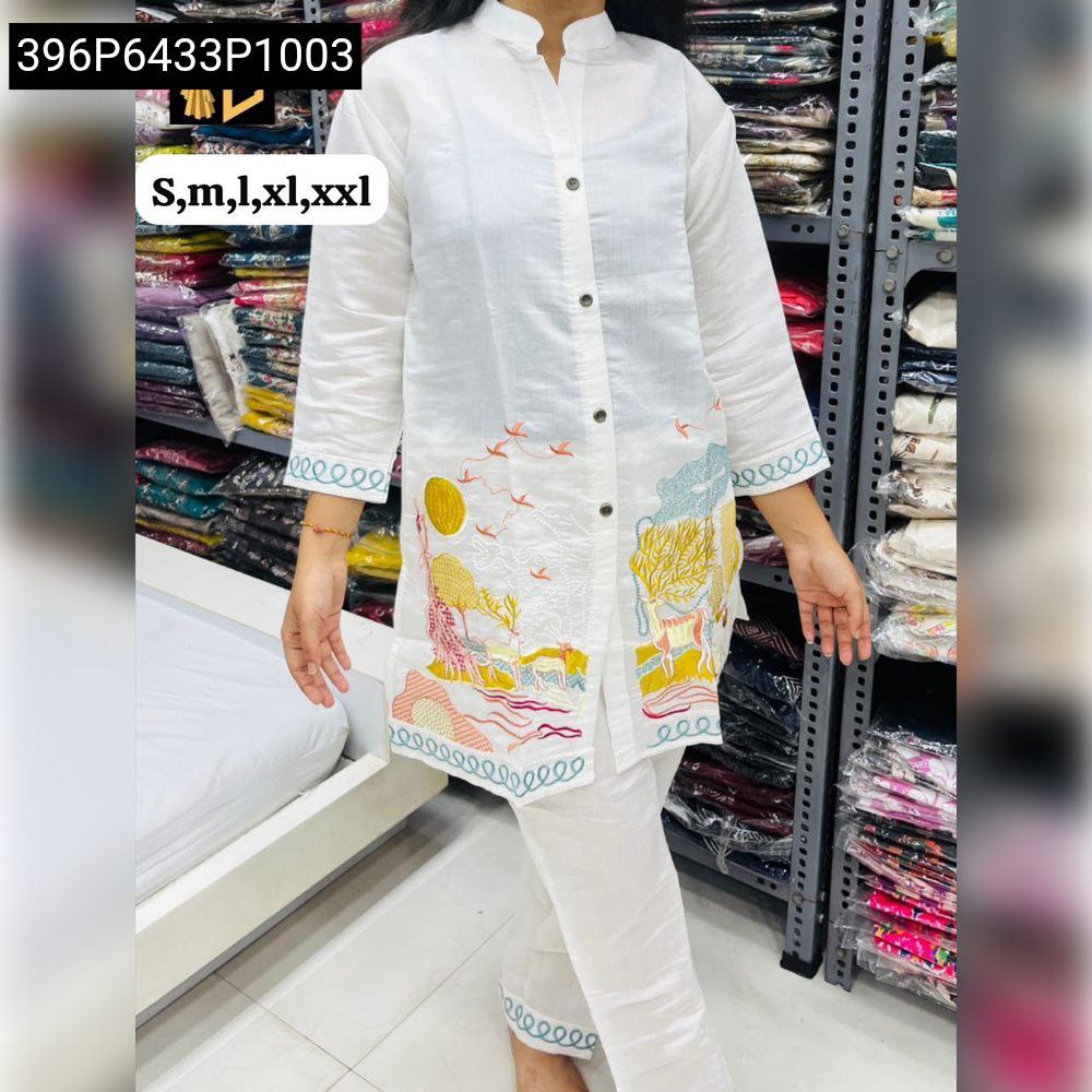 Women's white Premium Silk Kurta Pant Set with colorful embroidery, full body model shot.