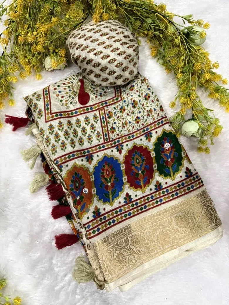 Folded off-white soft crepe silk saree with multicolored motifs and gold border