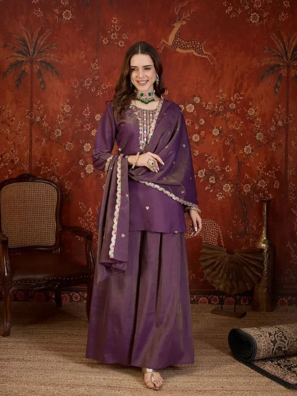 Full body front view of model wearing purple tissue silk suit with heavy embroidery