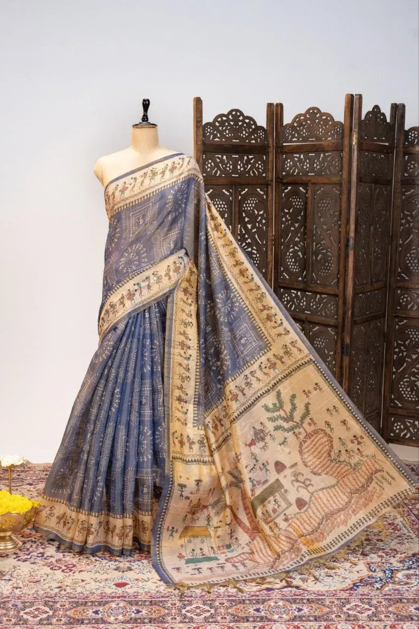 Blue tissue tussar silk saree draped on mannequin with printed pallu