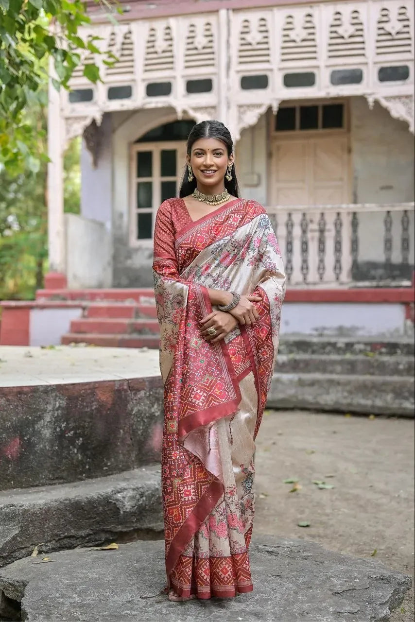 Full view of model in red tussar silk saree with traditional patola border