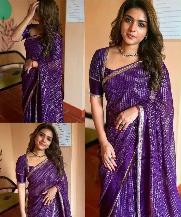 Model wearing purple georgette saree with matching blouse and ethnic jewelry