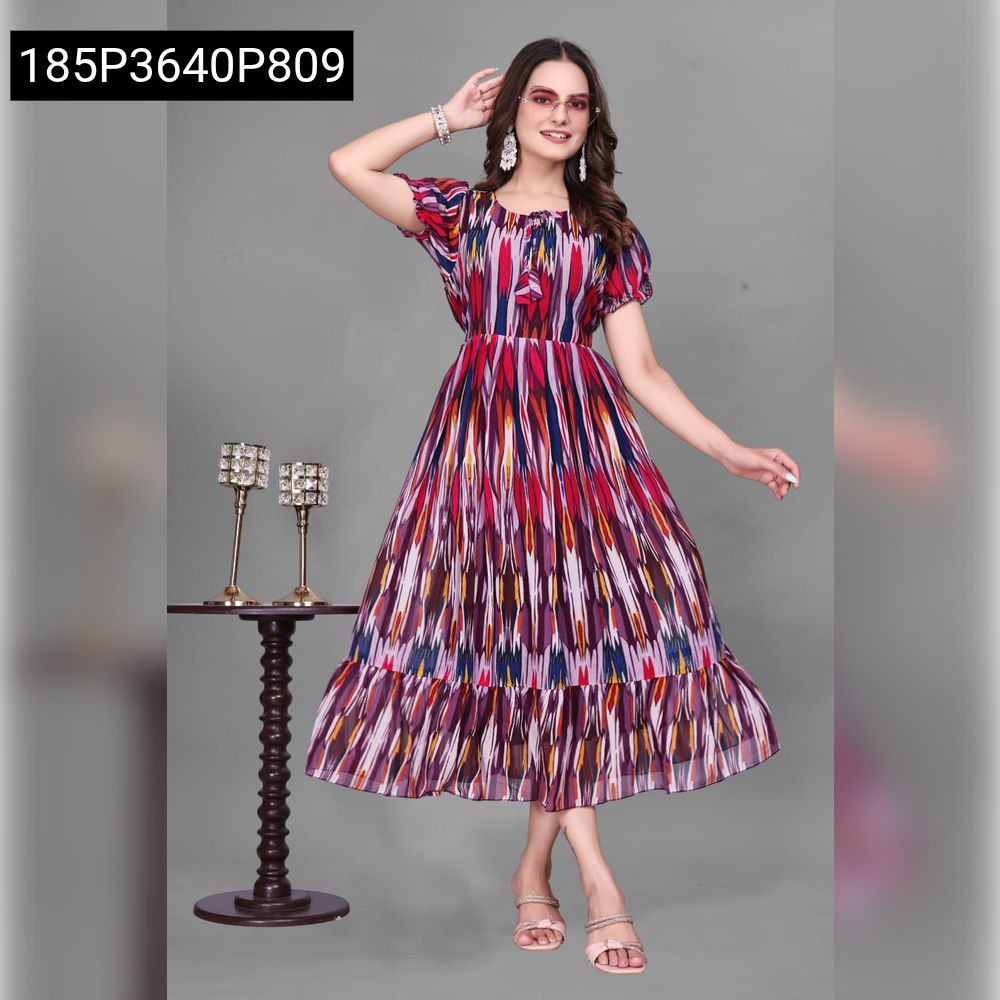 Model wearing a multi-color abstract printed Georgette midi dress with berry and purple tones, front pose.