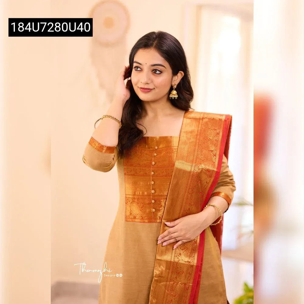 Model wearing a mustard gold Pure Banarasi Jeni Suit Set with red-gold zari dupatta, front pose