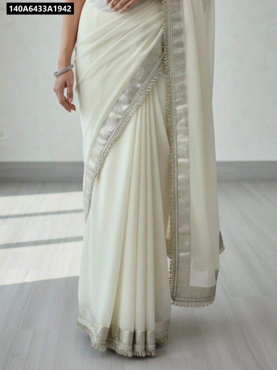 Model showcasing the graceful drape of TRENDBUY Off-White Chiffon Saree