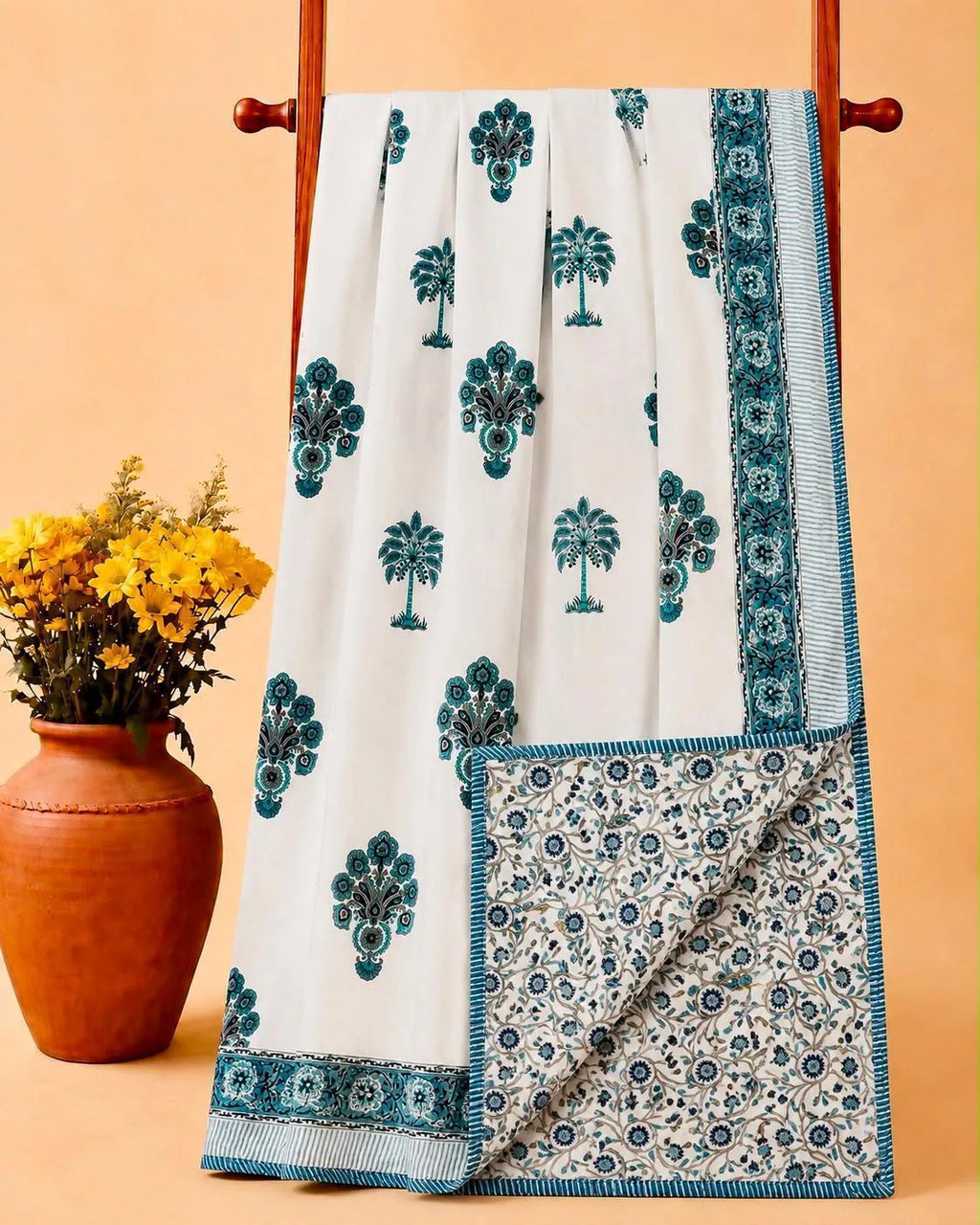 Teal palm tree hand block print cotton dohar hanging on wooden rack