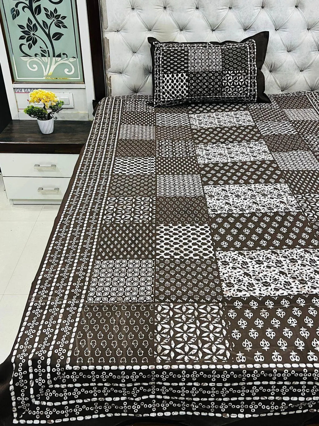 Brown patchwork print pure cotton single bedsheet with matching zipped pillow cover on bed
