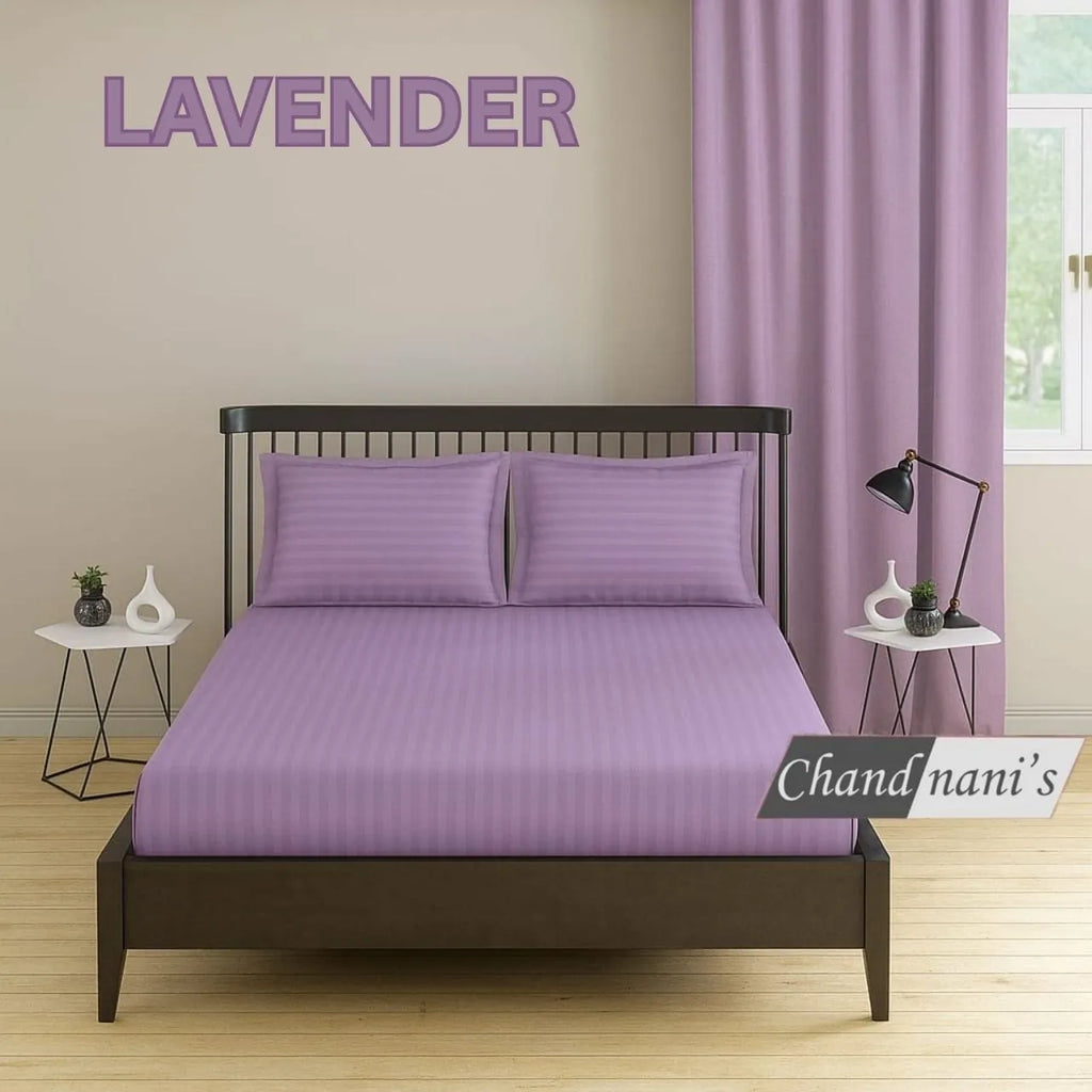 Lavender striped cotton super king bedsheet with matching pillow covers on bed