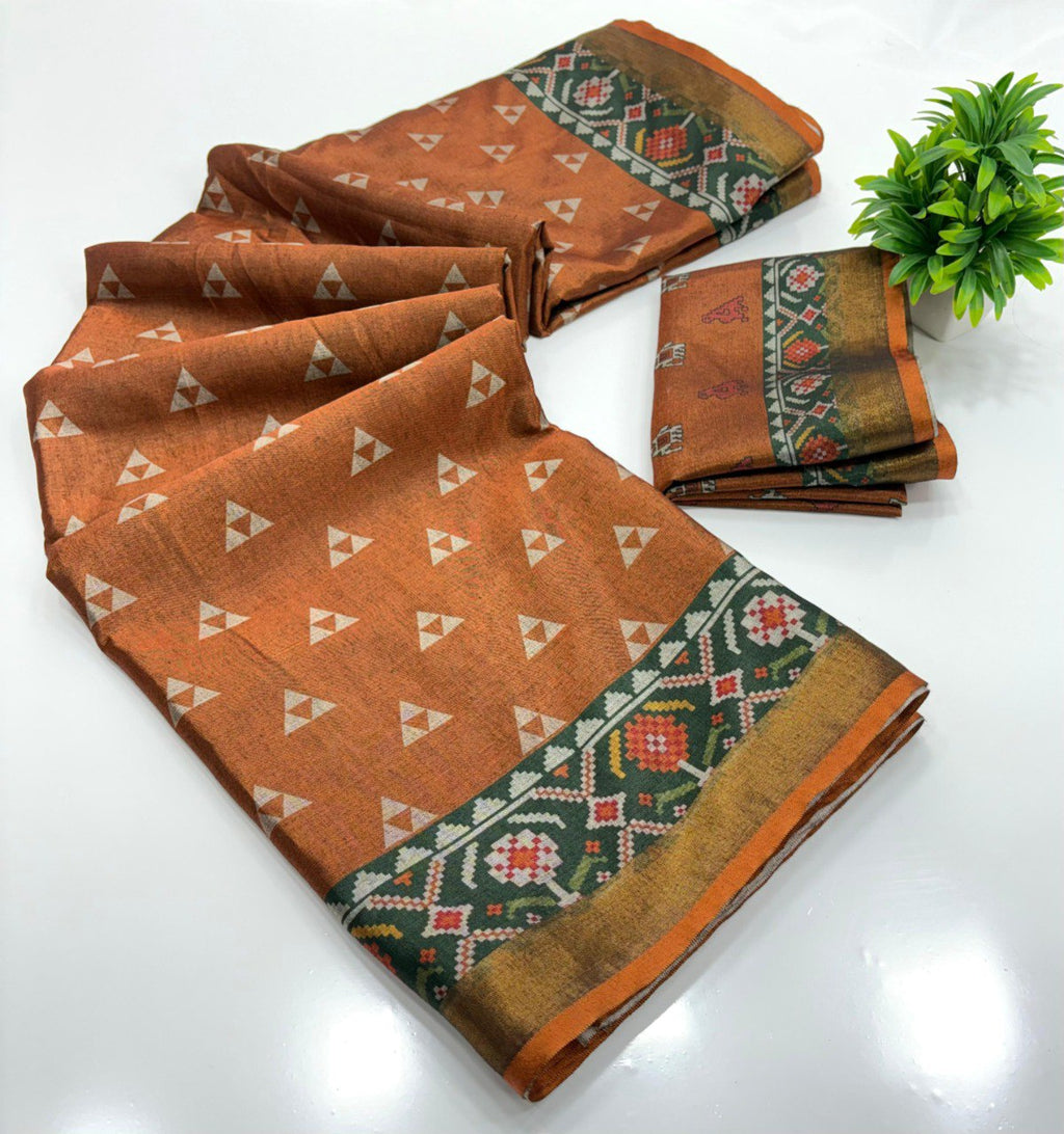 TRENDBUY Pure Malmal Silk Saree in Rust Orange with Zari Woven Border and Exclusive Print, folded.