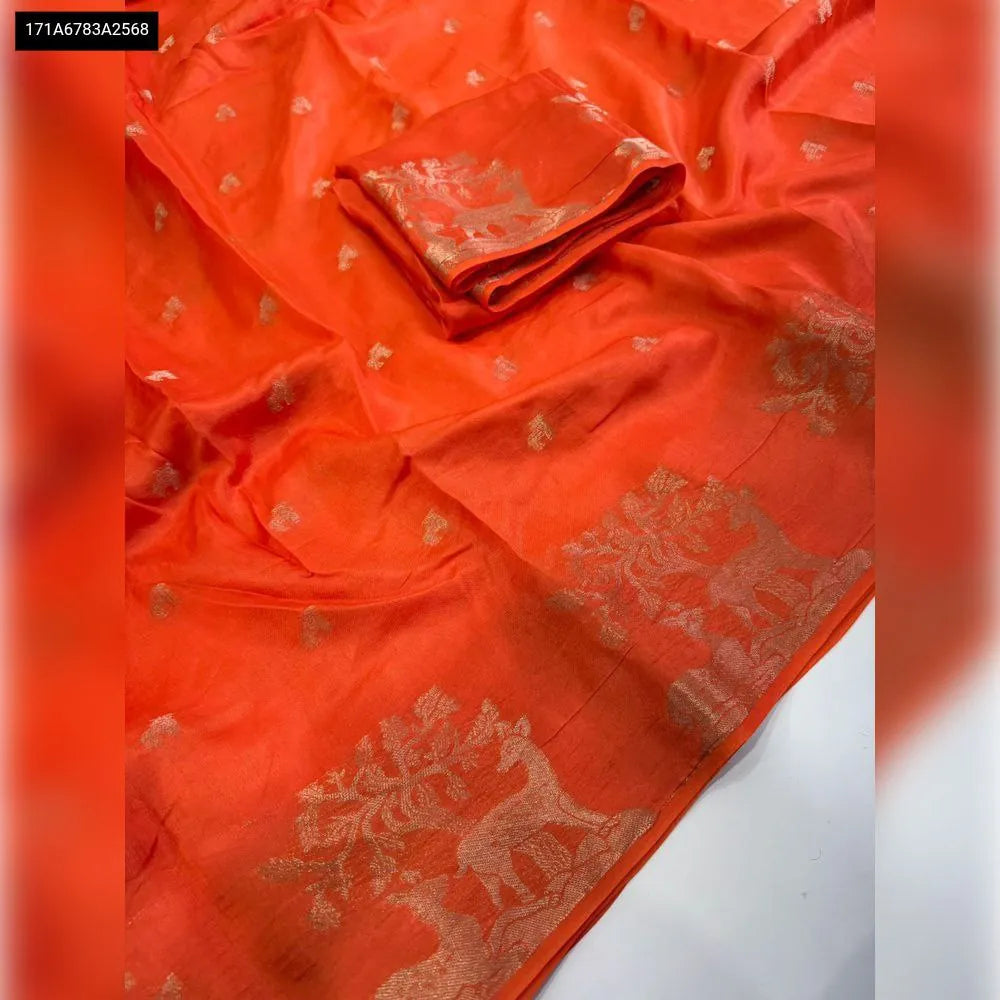 Vibrant Pure Muslin Silk Saree in bright orange with golden deer and tree motif weave, featuring a matching running blouse piece. Ideal for festive events.