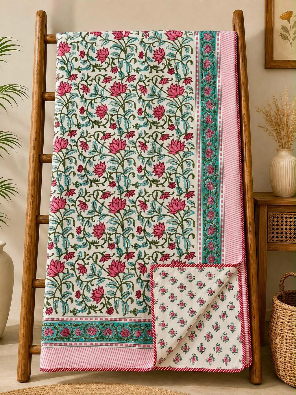 Pink lotus and green vine hand block print double dohar hanging on wooden ladder