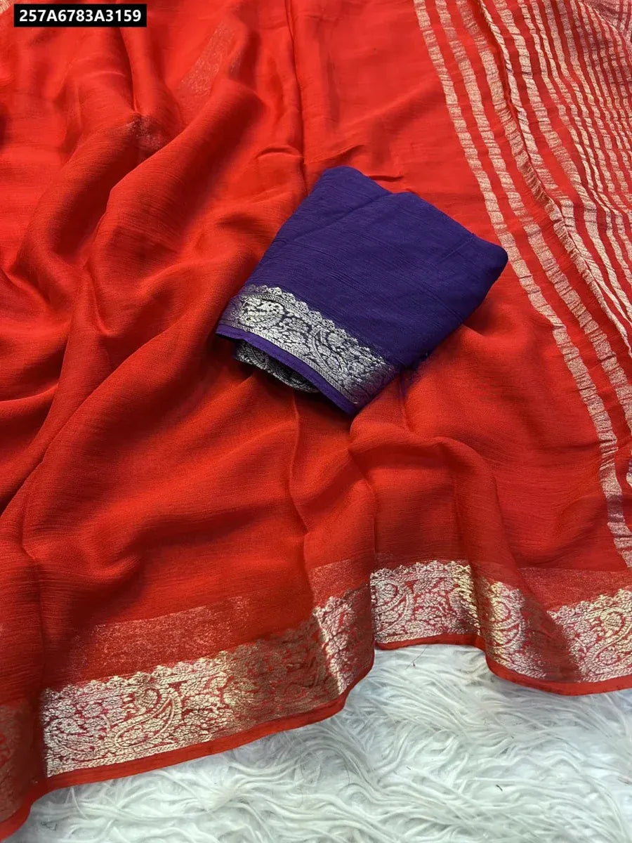 Coral Red Viscose Georgette Saree with intricate gold border and contrasting Purple blouse