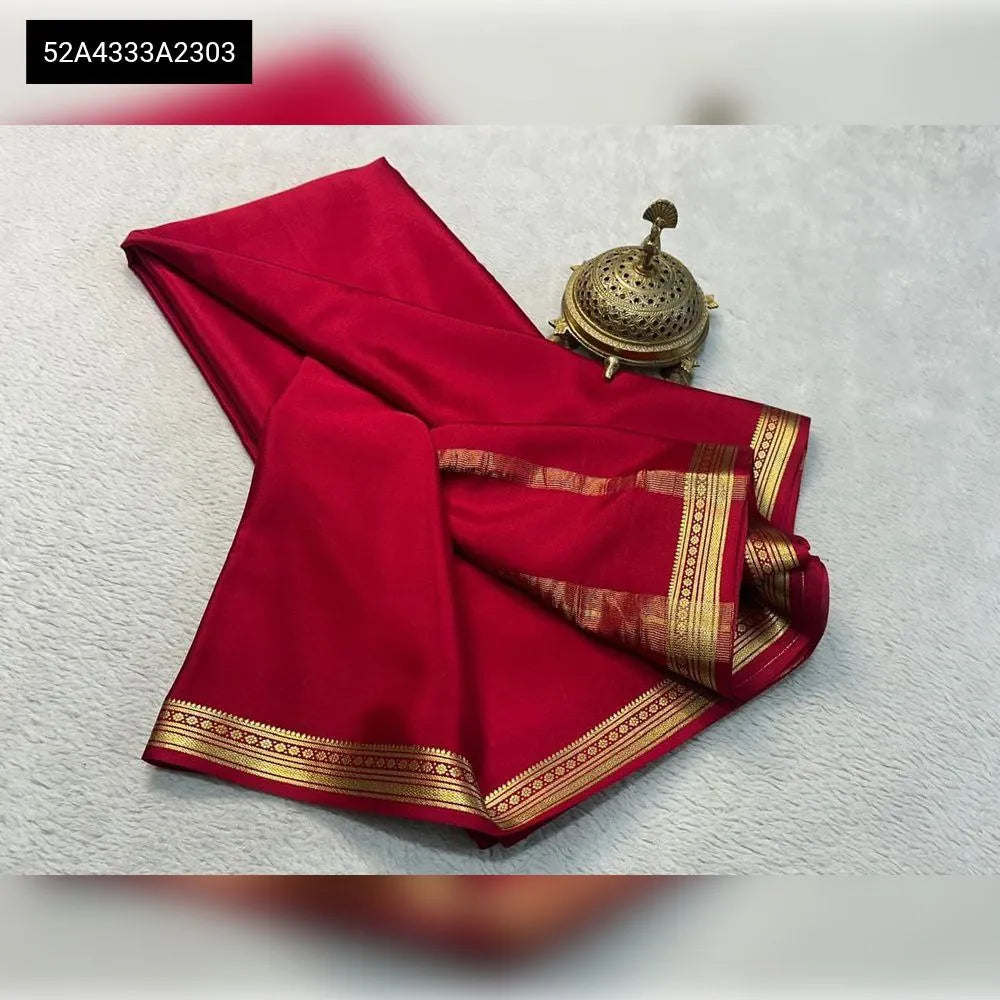 Red pure viscose silk saree with fancy gold border, flat lay