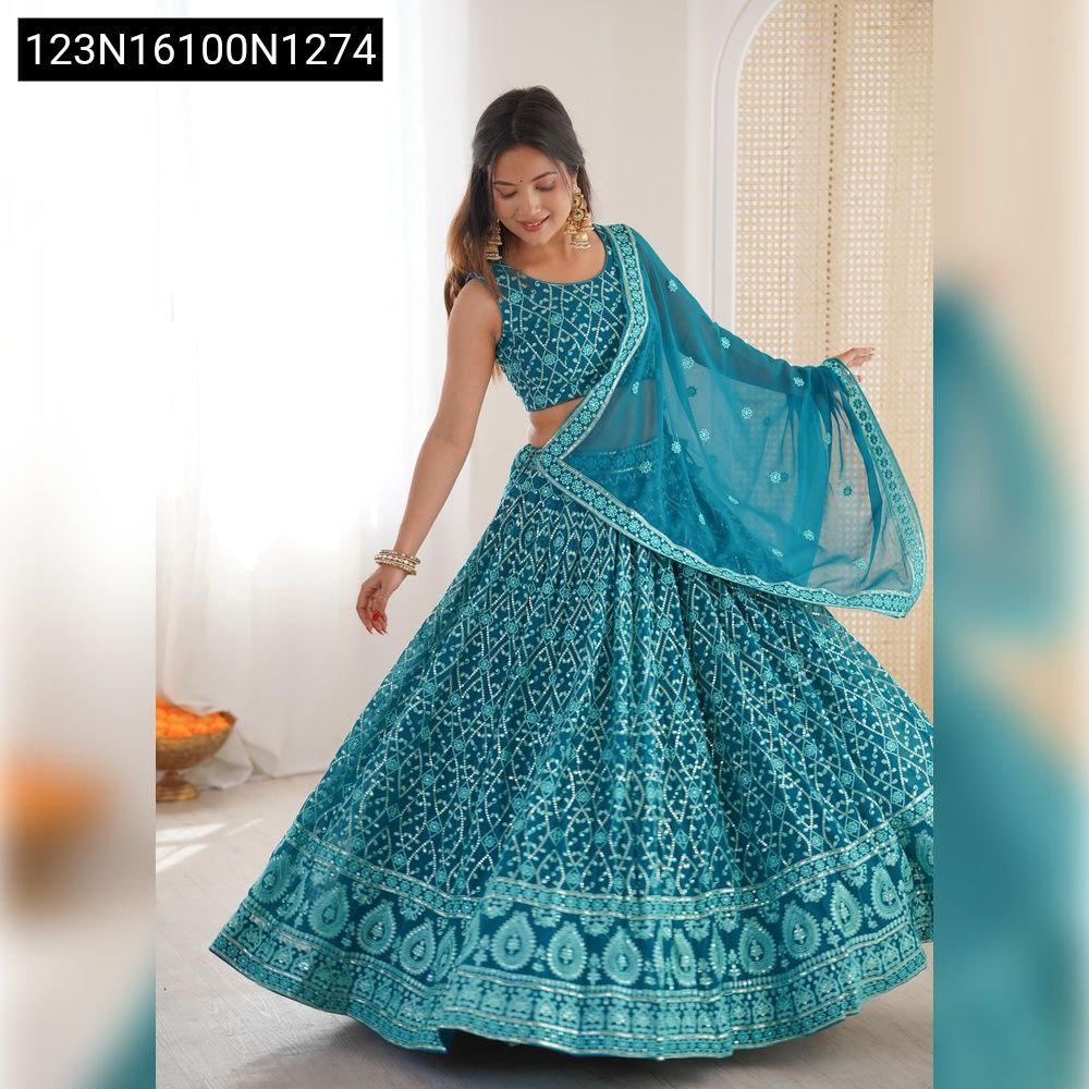 TRENDBUY Radiant Teal Blue Georgette Lehenga Choli with thread and sequin embroidery, modeled gracefully.